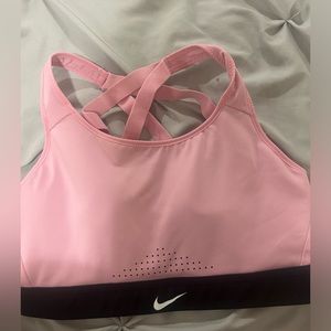 Light pink Nike sports bra with crisscross on back. Only worn twice